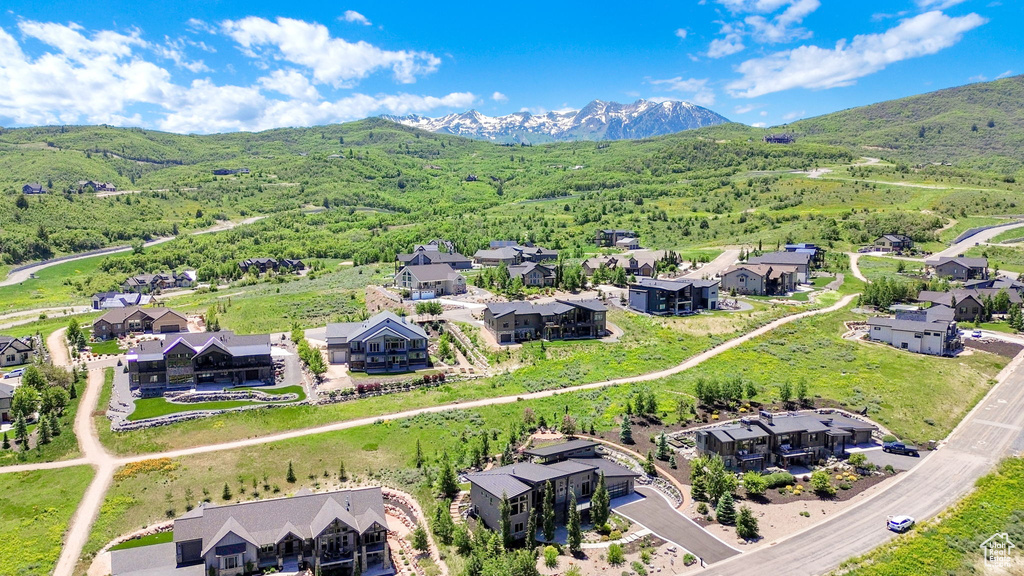 Aerial perspective of suburban area featuring a mountainous background