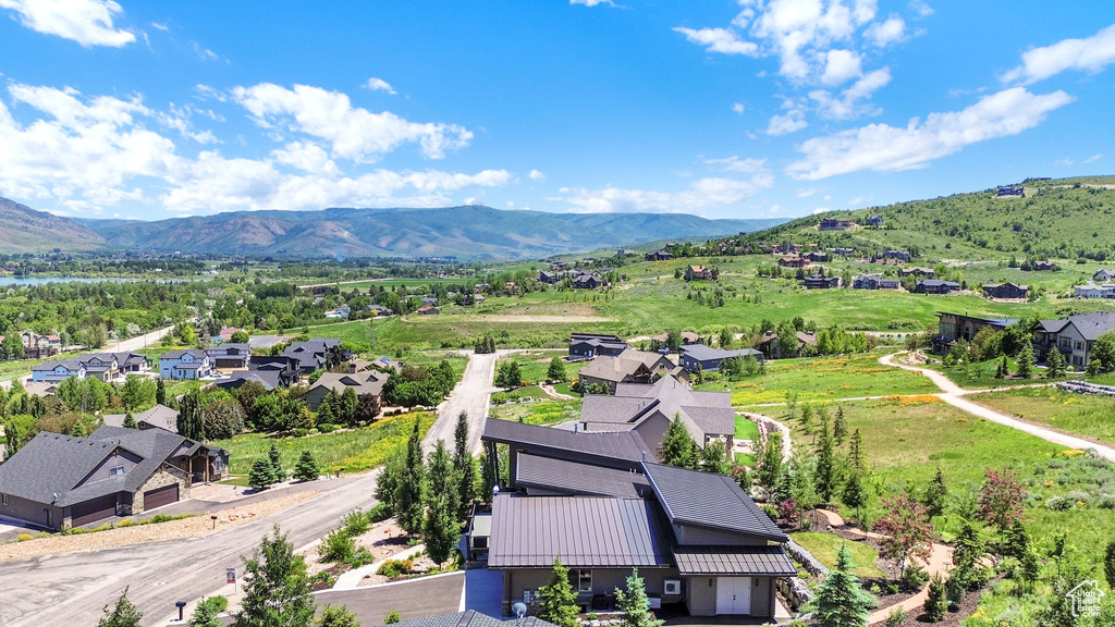 Aerial view of residential area featuring a mountain backdrop