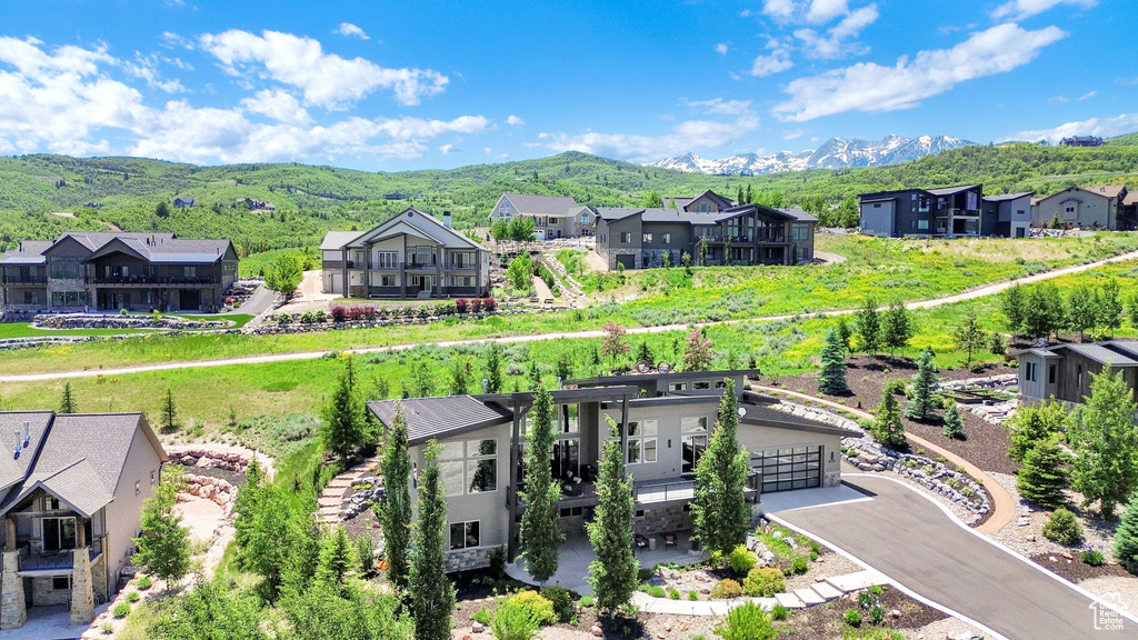 Aerial perspective of suburban area with a mountain backdrop