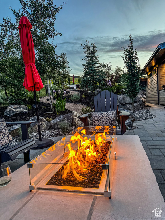 View of patio featuring a fire pit