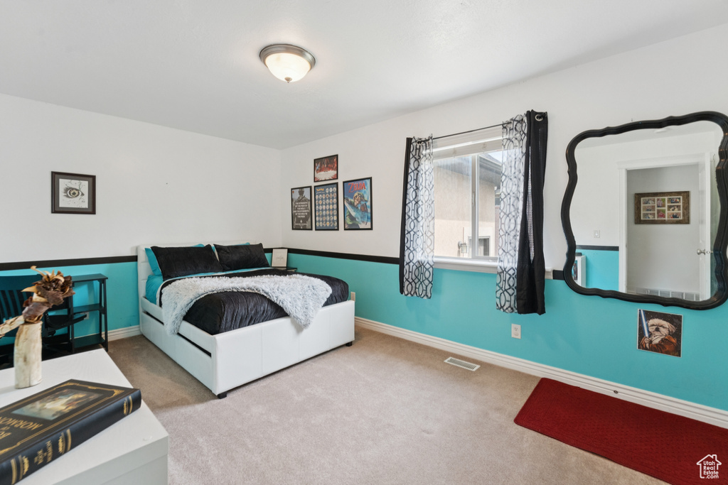 Carpeted bedroom with baseboards