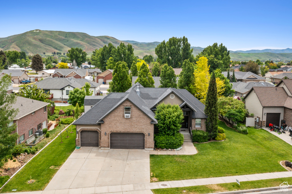 Aerial perspective of suburban area featuring a mountainous background