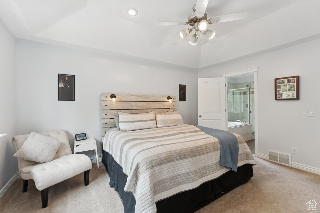 Bedroom featuring carpet flooring, baseboards, ensuite bath, and a ceiling fan