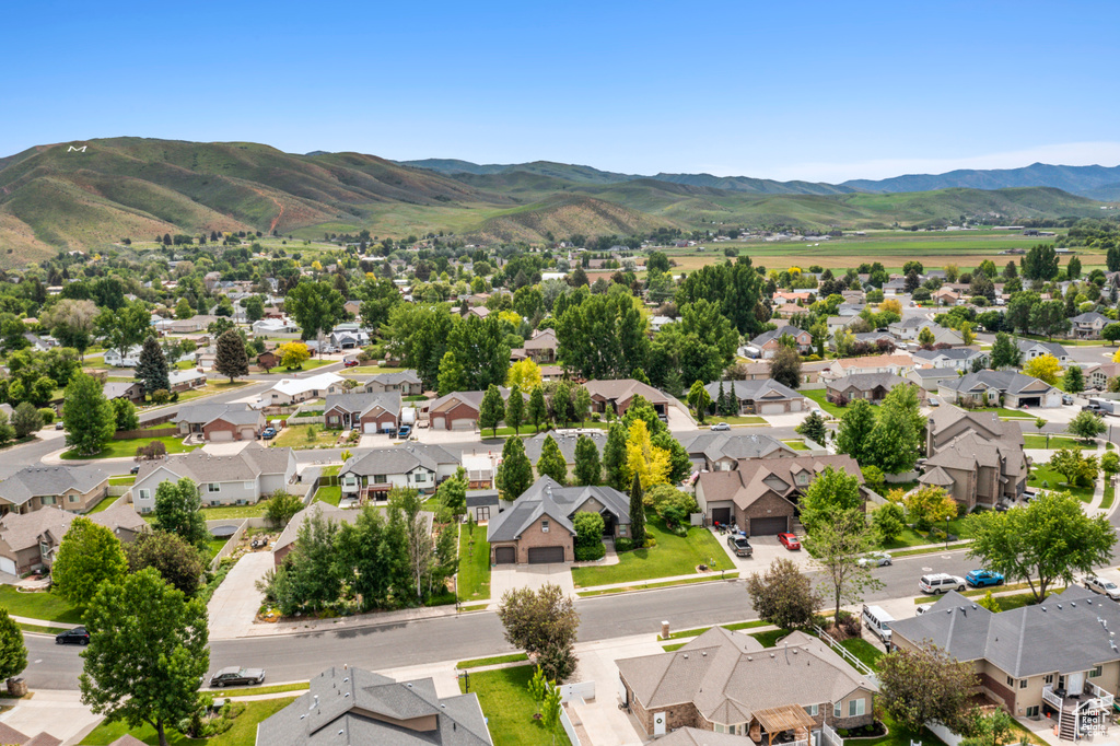 Aerial view of residential area with a mountainous background