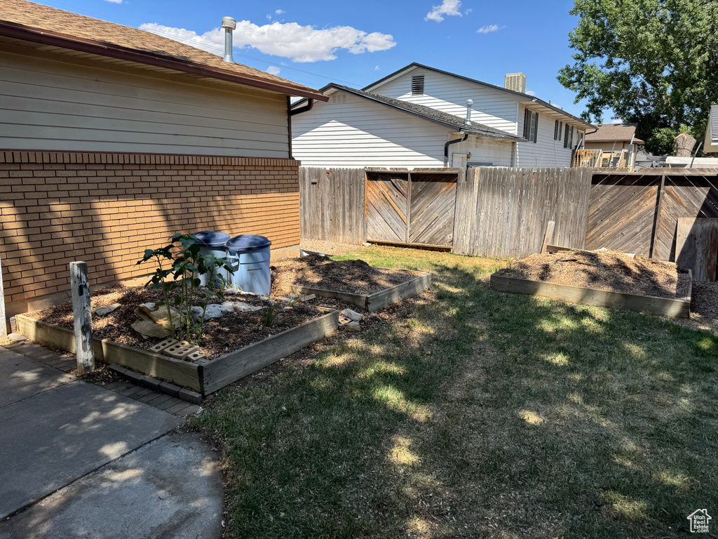 View of yard featuring a garden