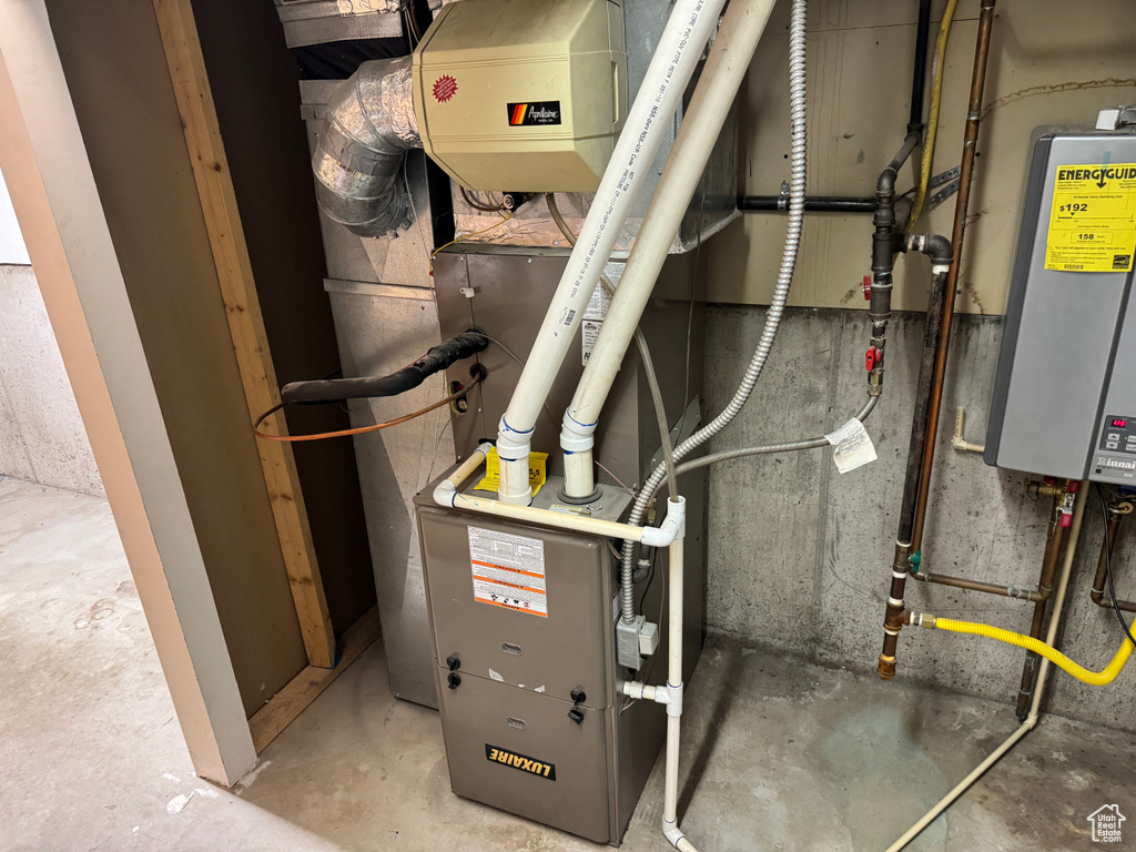 Utility room featuring water heater