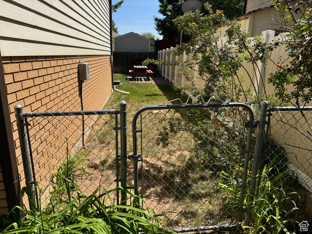 Gate with a fenced backyard