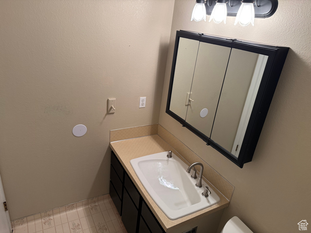 Bathroom with vanity and toilet