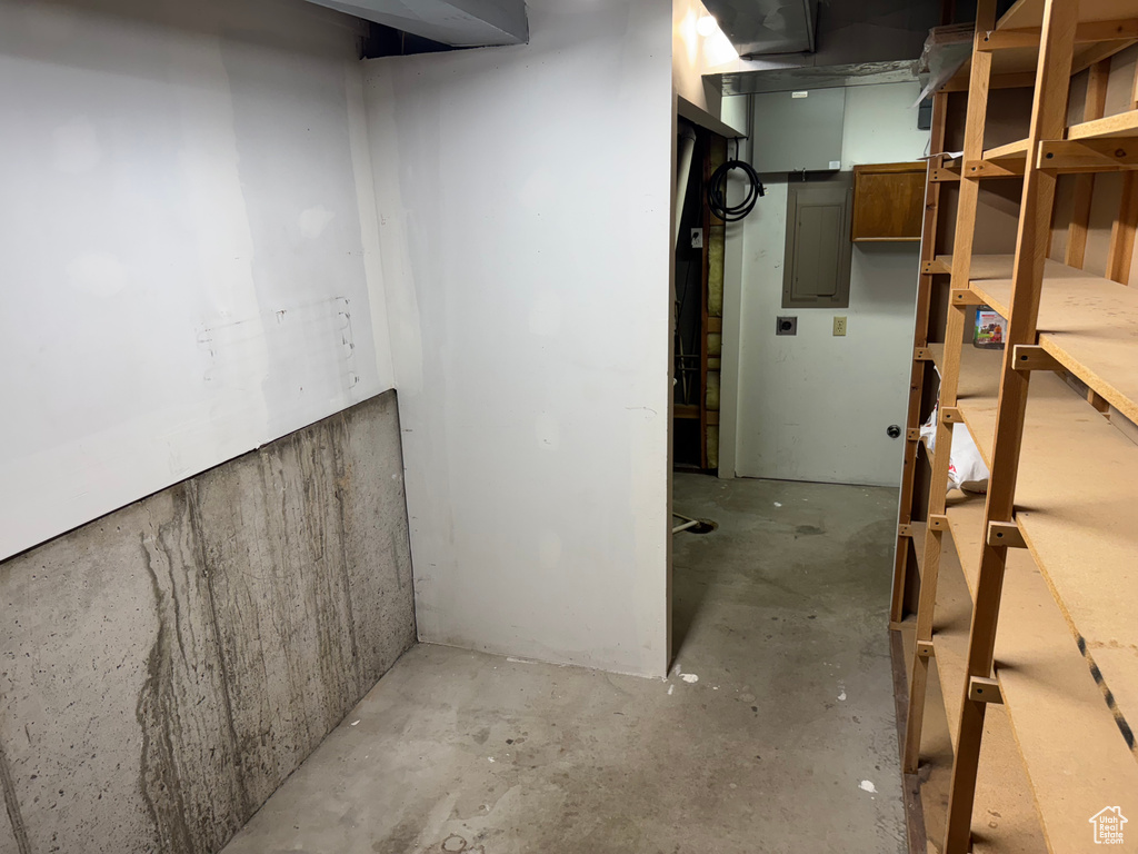 Unfinished below grade area with electric panel