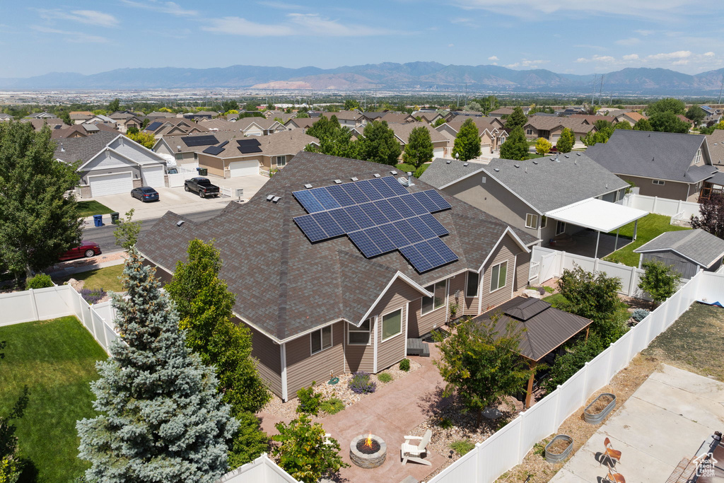 Aerial view of residential area featuring a mountain backdrop
