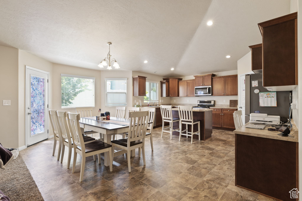 Dining room featuring a chandelier and recessed lighting