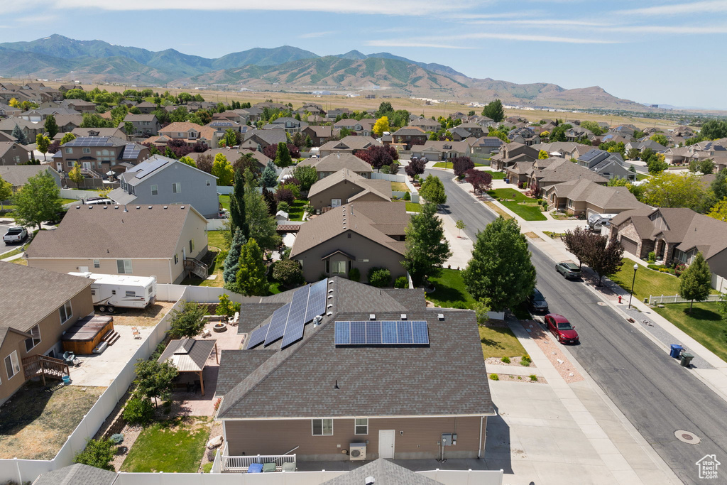 Aerial view of residential area featuring a mountainous background