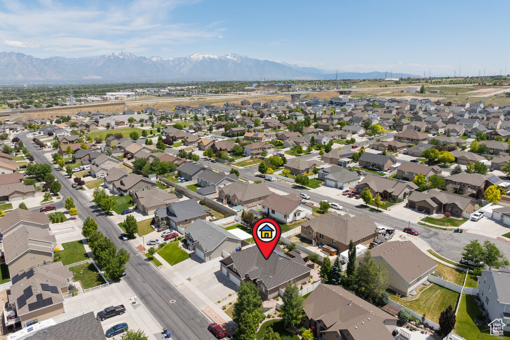 Aerial view of property\'s location with a mountainous background and nearby suburban area