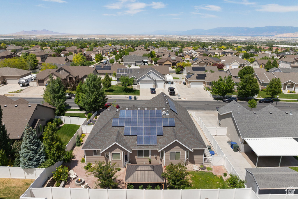 Aerial perspective of suburban area with a mountainous background