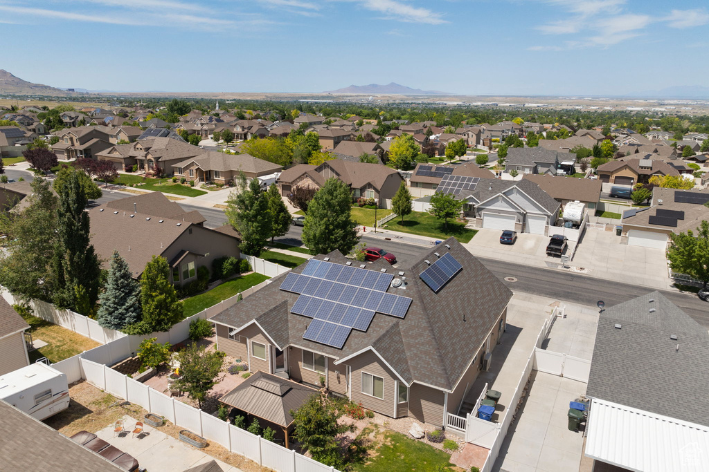 Aerial perspective of suburban area with a mountainous background