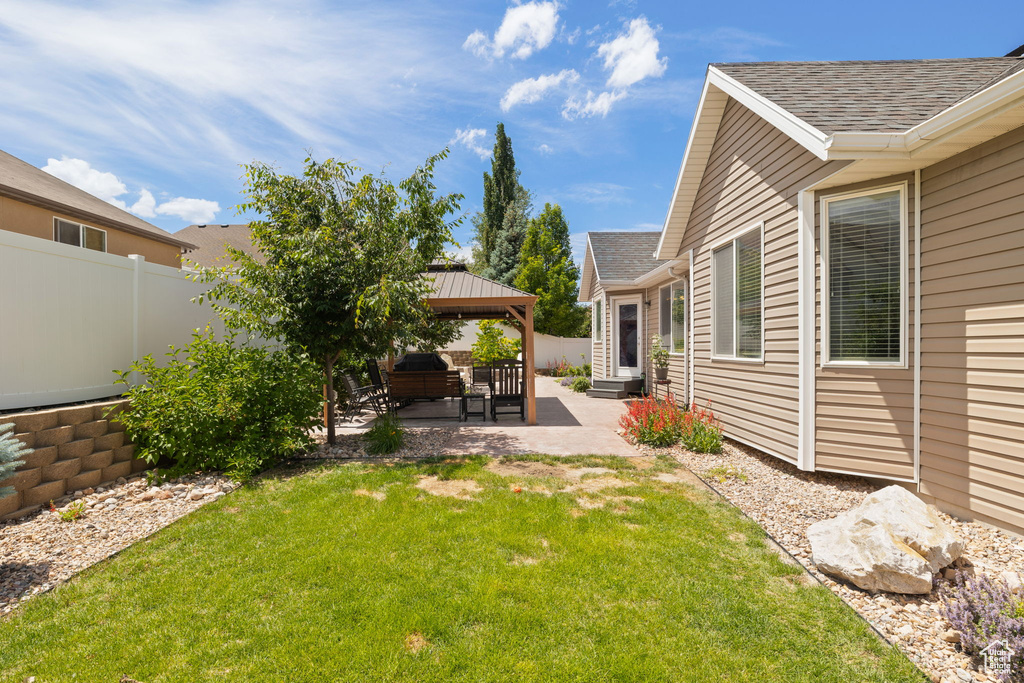 View of yard with a gazebo and a patio area