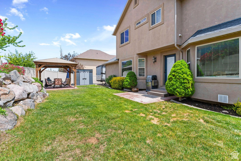 View of yard featuring a gazebo and a patio area
