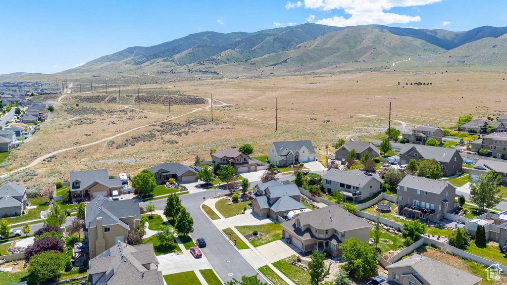 Aerial view of residential area with a mountainous background