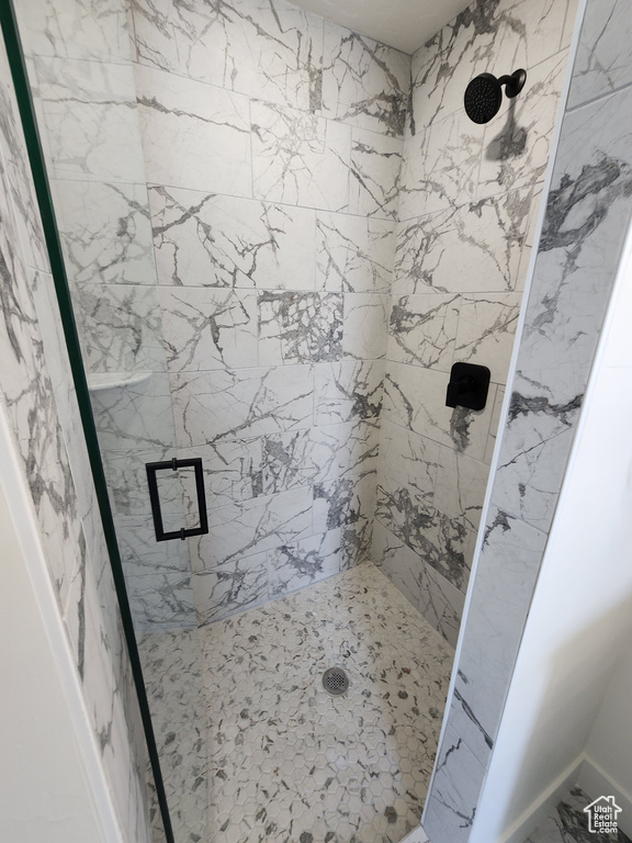Bathroom featuring a shower stall