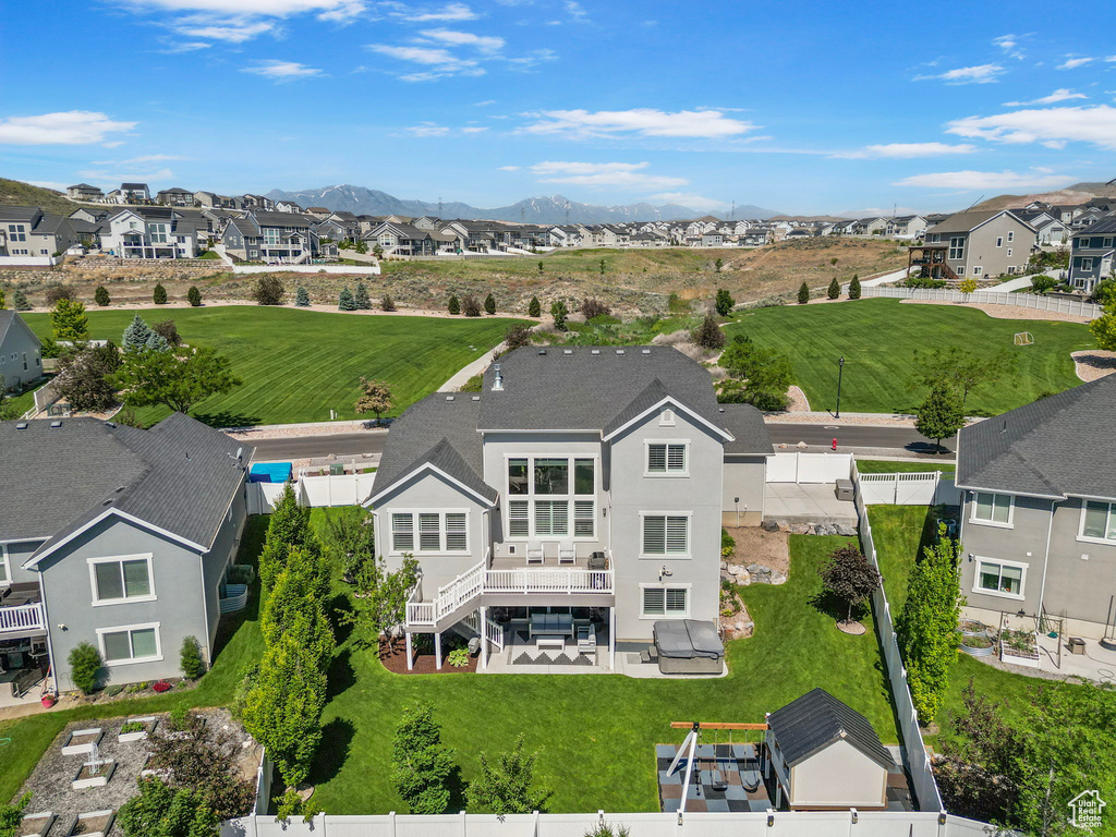 Aerial view of residential area with a mountainous background