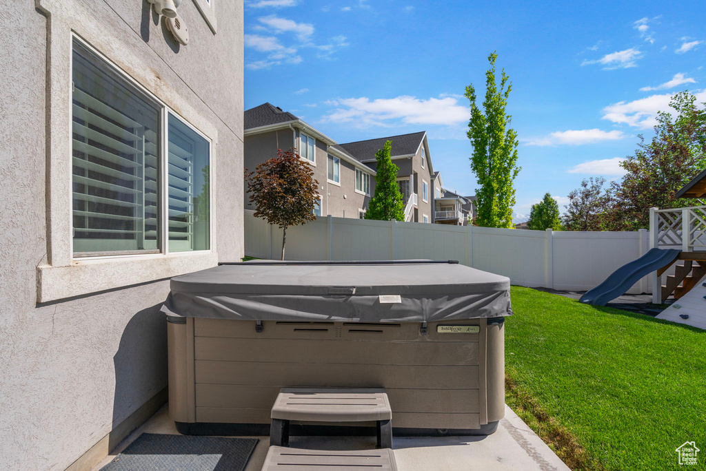 View of patio / terrace with a hot tub