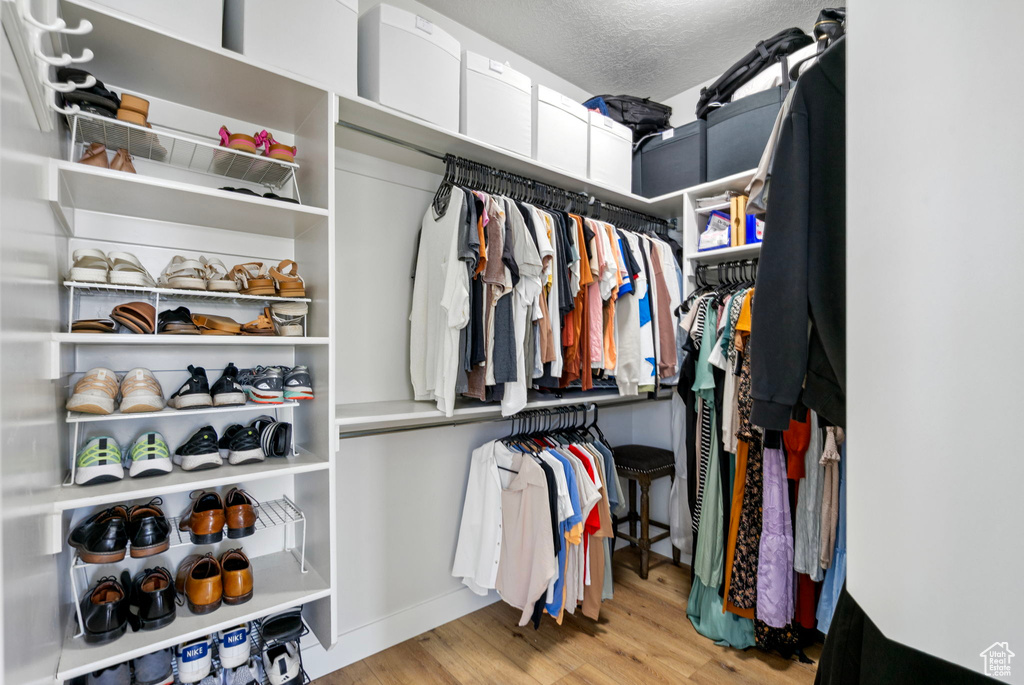 Spacious closet featuring wood finished floors