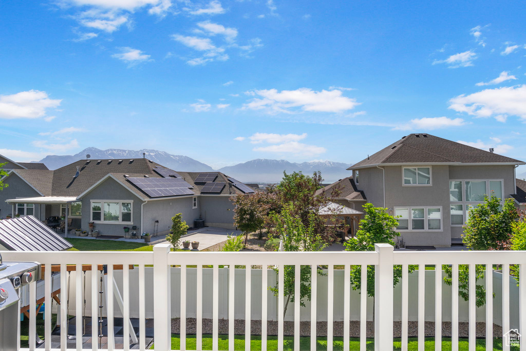 Exterior space featuring mountains and nearby suburban area