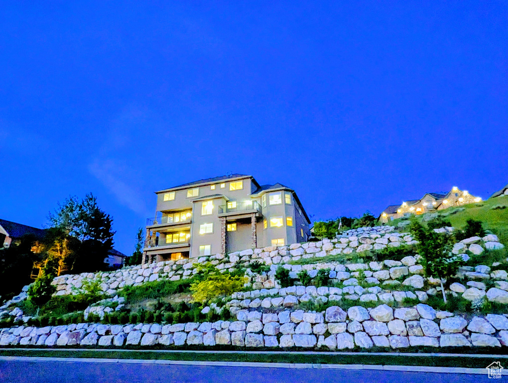 View of property at twilight