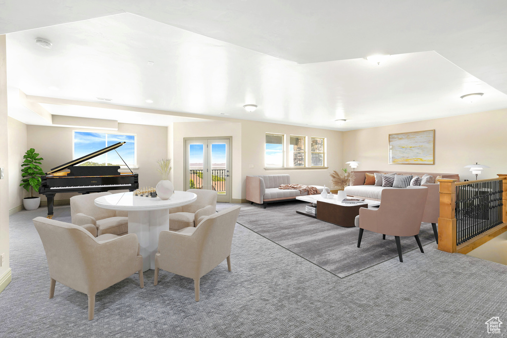 Living area with carpet floors and healthy amount of natural light