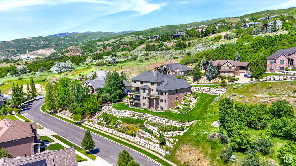 Aerial perspective of suburban area with a mountain backdrop