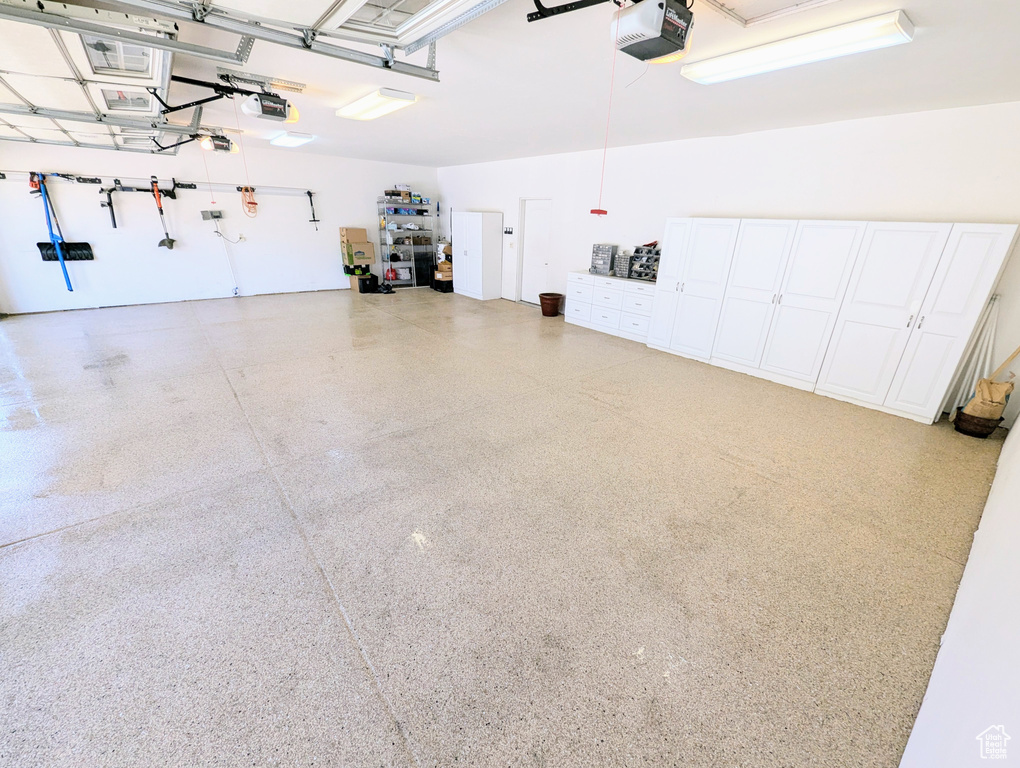 Garage featuring a garage door opener