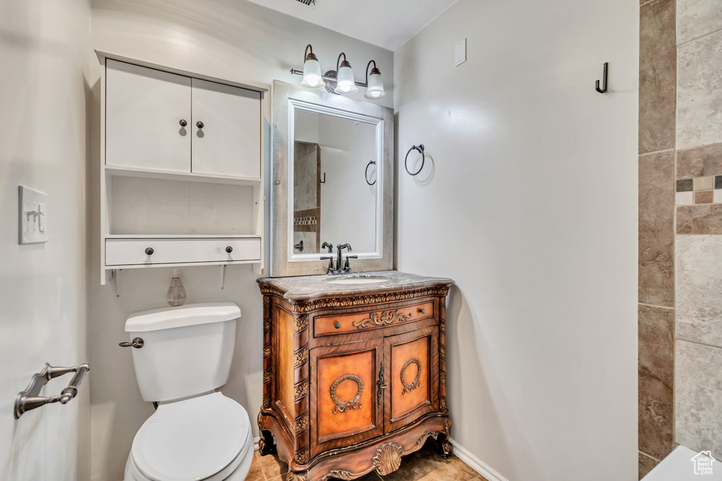 Full bathroom featuring vanity and toilet