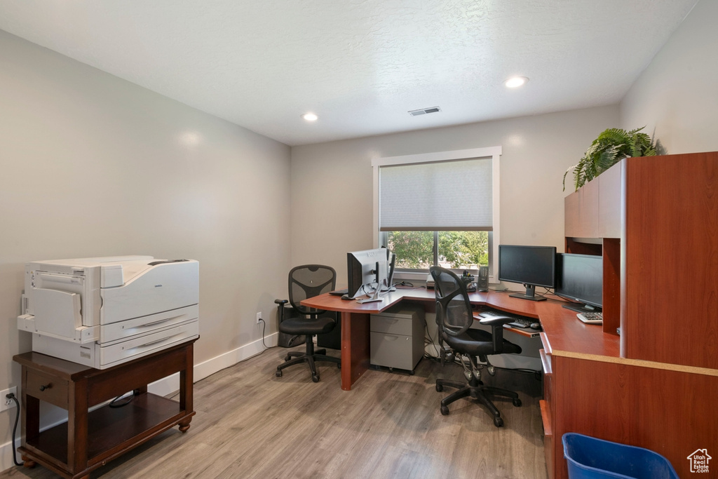 Home office featuring light wood-type flooring, recessed lighting, and baseboards