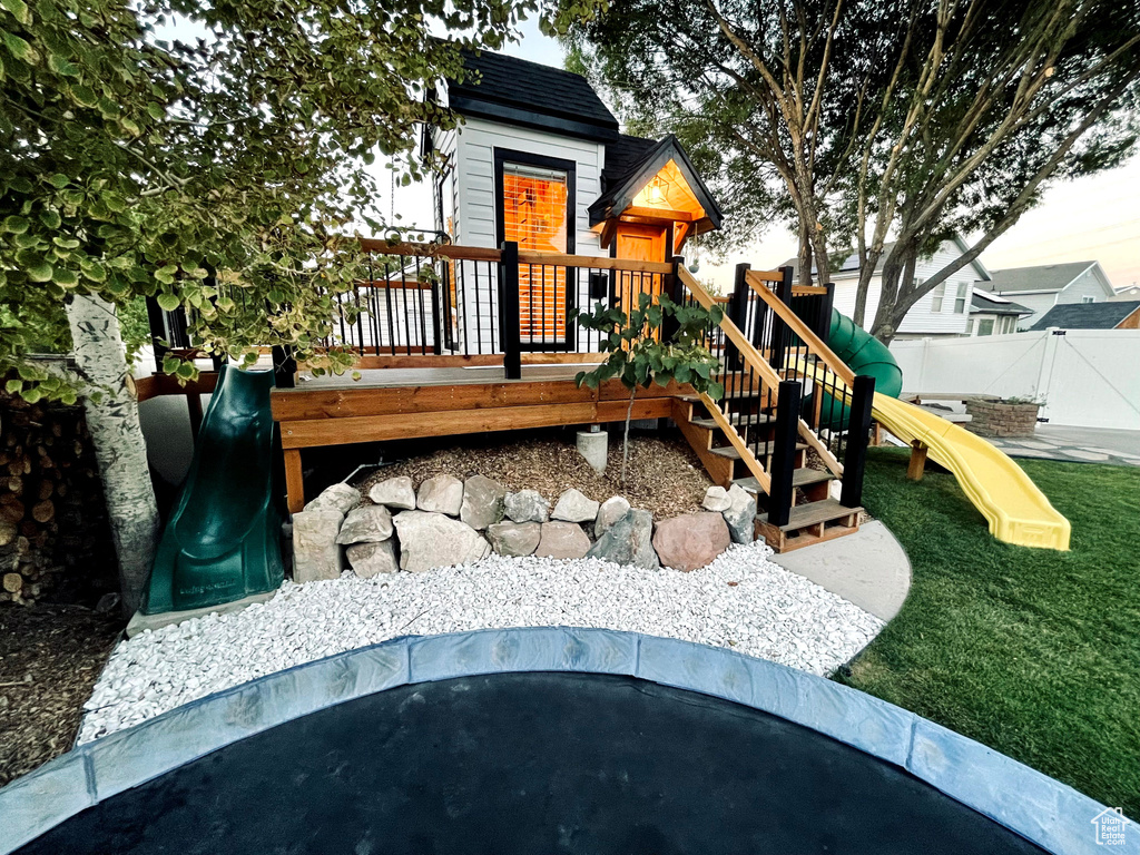 View of playground with a deck
