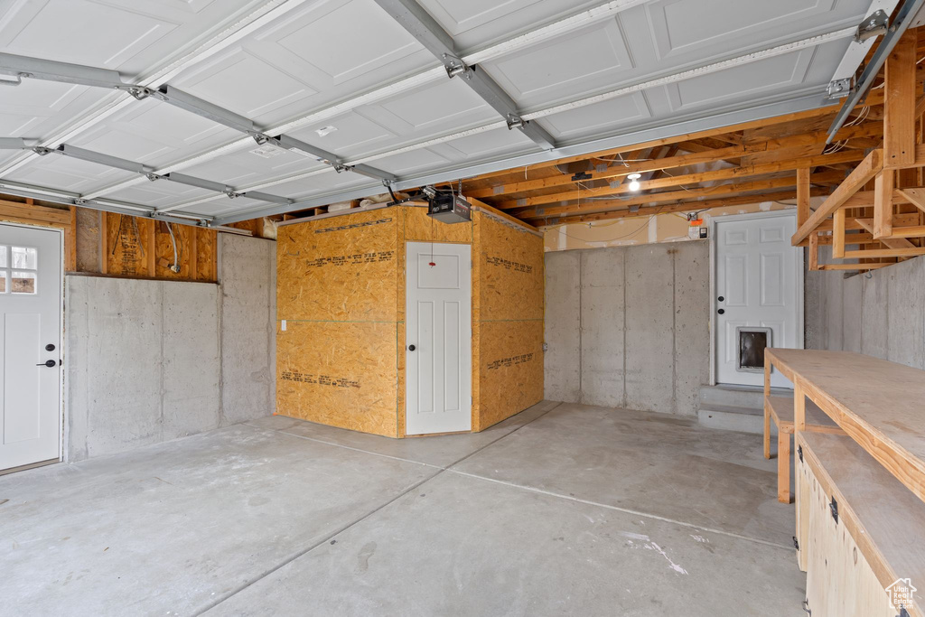 Garage featuring a garage door opener
