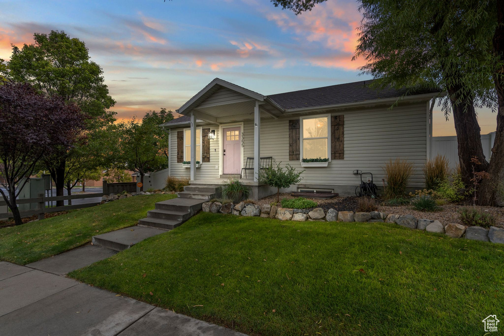 View of front of home with a shingled roof