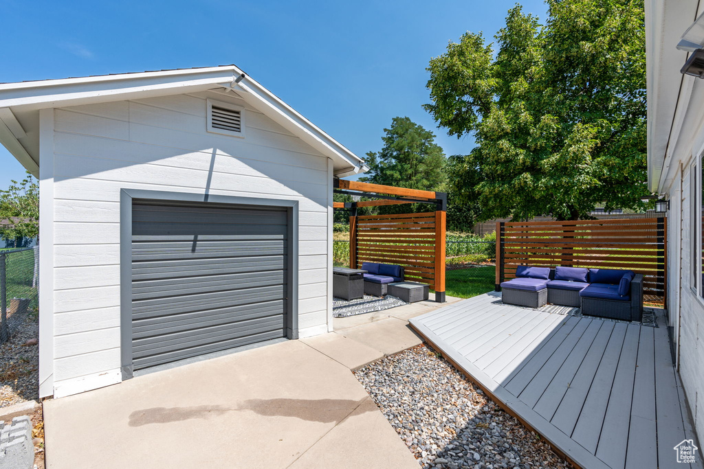 Garage featuring concrete driveway
