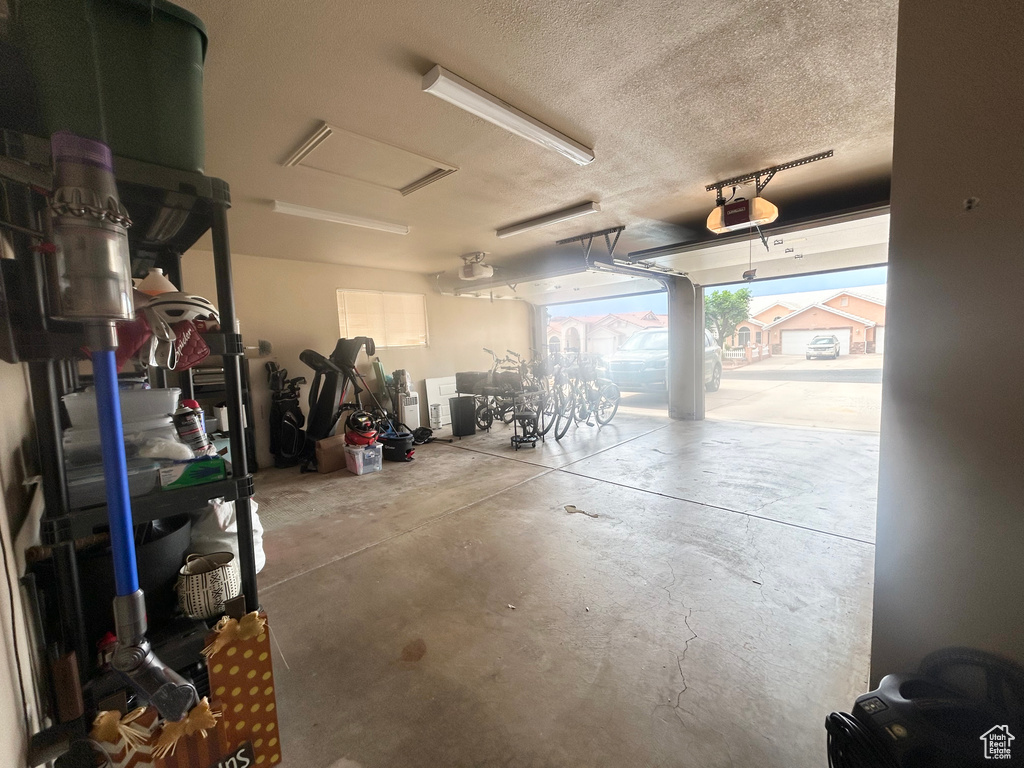 Garage featuring a garage door opener
