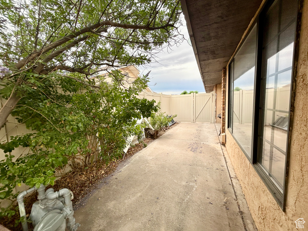 View of patio featuring a gate