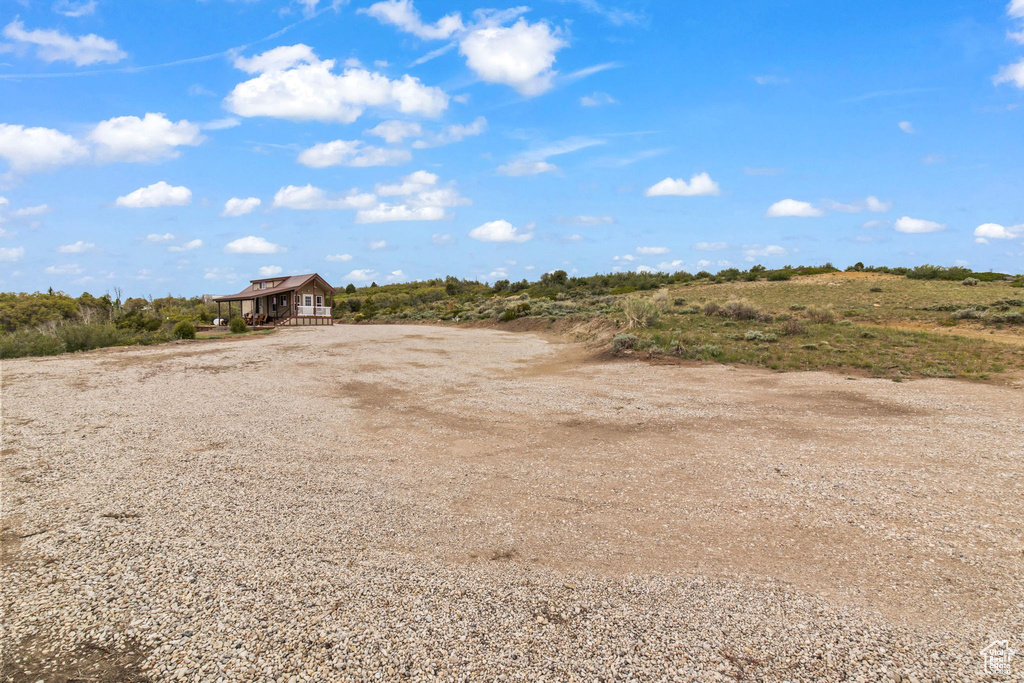 View of yard with gravel driveway