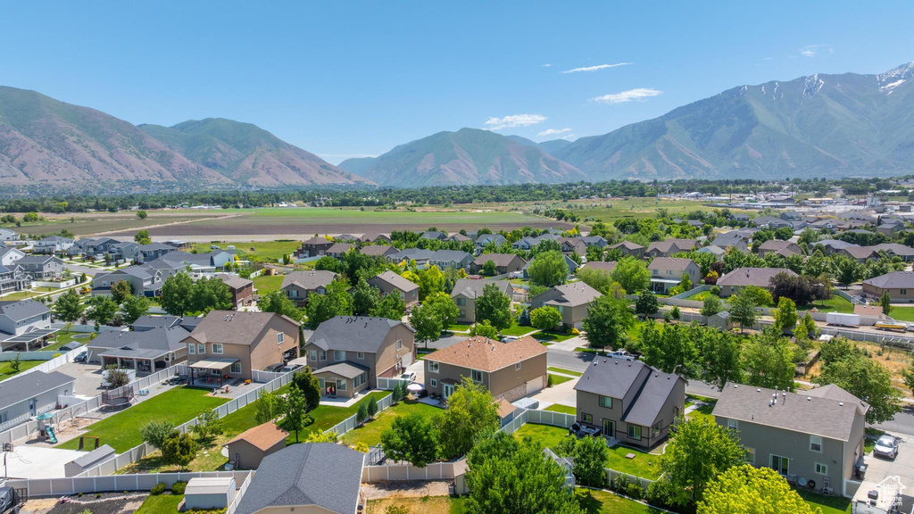 Aerial perspective of suburban area featuring a mountainous background