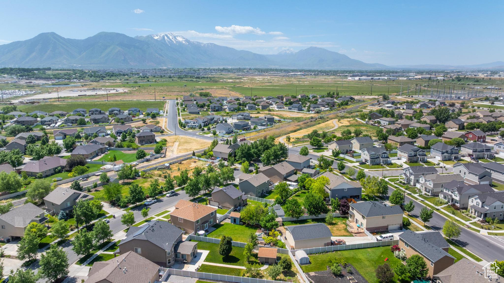 View of property location featuring mountains and nearby suburban area