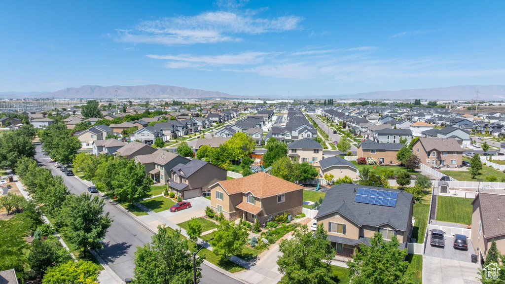 Aerial view of residential area featuring a mountain backdrop