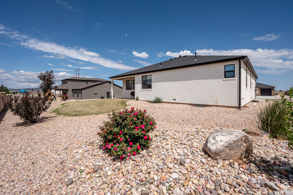 Back of property with stucco siding