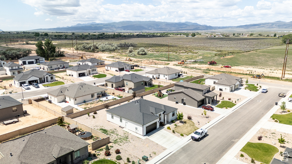 Aerial view of residential area featuring a mountainous background