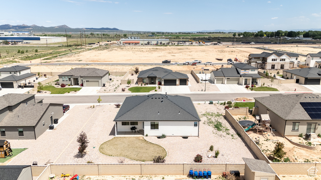 Aerial perspective of suburban area featuring a mountain backdrop