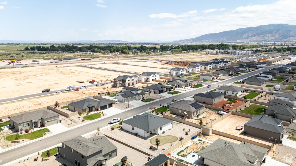 Aerial perspective of suburban area featuring a mountain backdrop