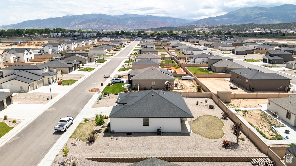 Aerial view of residential area with a mountainous background