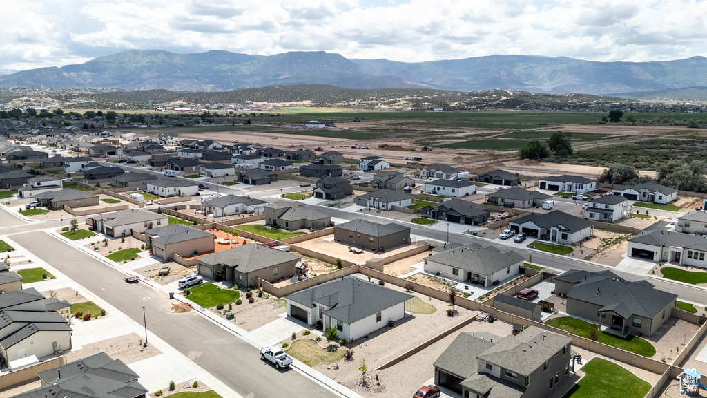 Aerial view of residential area with a mountainous background