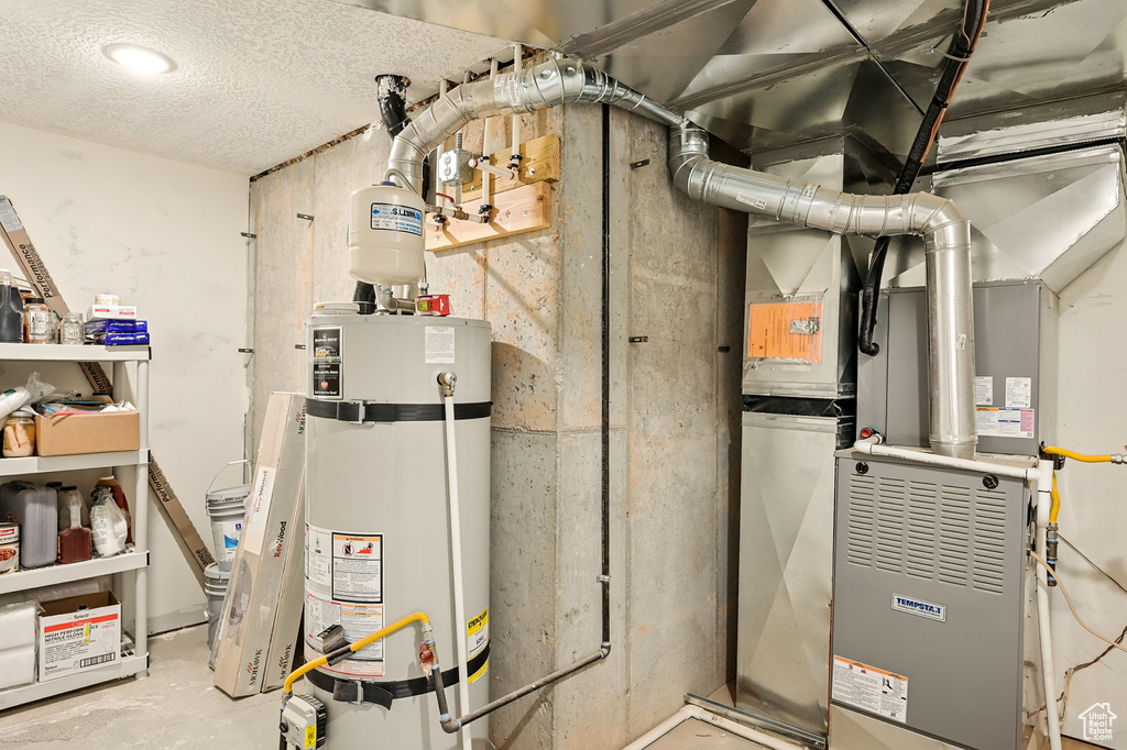 Utility room with strapped water heater